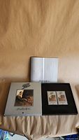 Slipcase, hardcover book and two sealed cassettes in presentation box