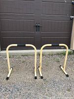 Two Lebert Equalizers dip bars standing side by side outdoors