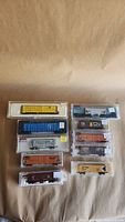 Stack of ten freight cars in plastic cases