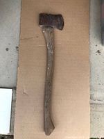 Full view of axe on cardboard