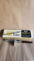 Phentex adjustable rug punch needle in front of original box