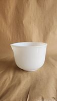 Side view of white milk glass mixing bowl showing shape and finish