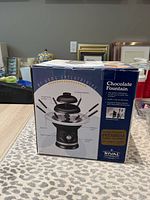 Photo of the boxed Rival chocolate fountain showing product image and description.