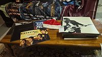 Lot overview with Bon Jovi cap, vinyl stacks and Backstreet Boys print