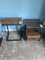 Two side tables placed side by side against a blue wall, showing overall size and form.
