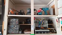 Shelf with Ridgid palm sander, Bosch sander, Makita drill, hardware compartments, hand tool organizer with tools