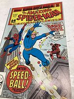 Photo displaying cover of The Amazing Spider-Man Annual No. 22 comic book featuring Spider-Man, Daredevil, and Speedball on colorful cover.