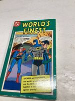 Front cover of the comic book titled 'World's Finest' featuring Batman and Superman in costume.