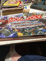 Box cover showing Monopoly Transformers Collector's Edition branding with characters from the franchise.