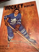 Cover of Hockey Blueline magazine January 1959 showing artwork of Dickie Duff in Toronto Maple Leafs hockey attire
