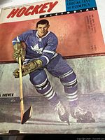 Color illustrated cover featuring hockey player Al Brewer in Toronto Maple Leafs uniform holding a hockey stick, dated January 1960.