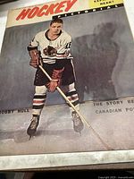 Cover of Hockey Pictorial magazine November 1959 with Bobby Hull in hockey gear on ice holding a stick.