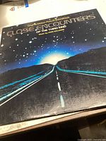 Front cover of the vinyl showing stylized night sky and road artwork