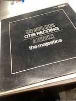 Front of the vinyl record album cover with title 'The Soul King Otis Redding A Tribute' by The Majestics in white text on a black background.