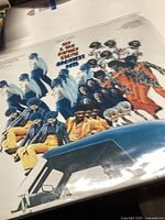 Front album cover featuring the band members in colorful attire, with the text 'Sly & The Family Stone Greatest Hits'.