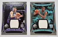 Two basketball cards side by side, one of Peja Stojakovic and one of Jamal Magloire, both with white fabric jersey patches.