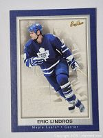 Front of the hockey card showing Eric Lindros in Toronto Maple Leafs uniform with Bee Hive branding.