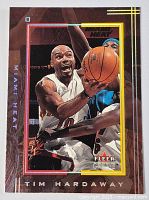 Front of the card showing Tim Hardaway in Miami Heat uniform driving to the basket with Fleer Genuine logo.