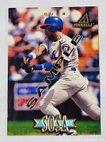 Front of the 1996 Pinnacle Sammy Sosa sample card showing Sosa batting for the Cubs with SAMPLE watermark.