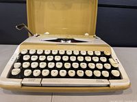Front close-up of 1971 Smith Corona Profile typewriter showing QWERTY keyboard, error control and power space keys.
