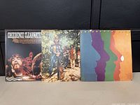 Front covers of all three Creedence Clearwater Revival albums: 'Pendulum', self-titled, and 'Creedence Gold'.