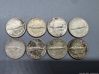 Reverse side of eight 1967 Canadian silver dimes showing Bluenose schooner image and inscriptions, worn condition.