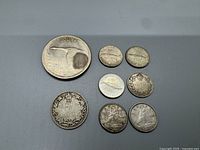 Top side of various Canadian silver coins showing denominations and design details