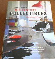 Front cover of the book showing the title 'Living With Mid-Century Collectibles' with a mid-century modern interior photo.