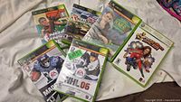 Front view of six Xbox game cases
