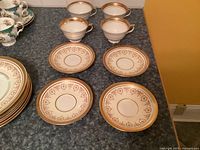 Top view of four cups and four saucers