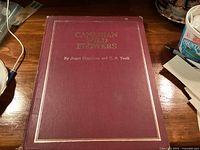 Front cover of maroon hardcover book with gilt title Canadian Wild Flowers