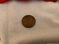 Bronze coronation medal on cloth background