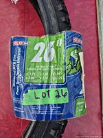 Close-up of CCM Universal MTB Tire label showing 26 in. size and fitment details