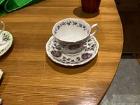 Teacup resting on saucer showing pattern and shape