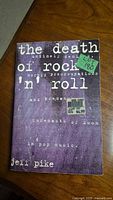 Front cover of The Death of Rock 'n' Roll book showing title, author, and condition