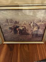 Front view of the framed print showing the three women gleaning grain in a rural field under a cloudy sky.
