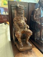 Close-up of Sancho Panza carved wood bookend, showing detailed carving and vintage patina.