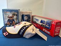 Collector's set with NASCAR memorabilia including cap, plush bear bank, miniature transporter truck, and cooler.