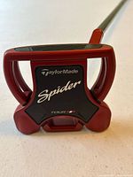 Close-up of putter head showing TaylorMade Spider Tour logo