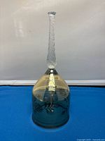 Full view of the vintage lead crystal bell showing the twisted handle and gold-trimmed dome with floral etching.