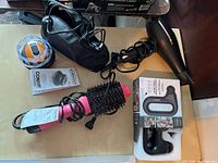 Overview of all items including hair dryer, hot air brush, massager and accessories