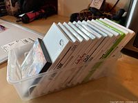 Mixed lot of Nintendo Wii game cases partially visible titles and one Nintendo DS game.