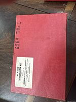 Closed hard red case labeled 'ESEA Title 1' with sticker showing kit name, brand, type, and kit number K-550-B.