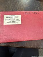 Red cardboard box lid with label for Sedimentary Rock Kit model K-552-B by Burminco Rocks and Minerals
