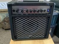 Front view of Randall RX15M amplifier showing control panel and speaker grille