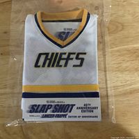 View of the Kansas City Chiefs mini shirt cover in sealed plastic packaging with commemorative label.