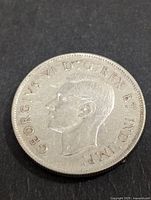 Obverse side of 1943 Canadian 50 cents silver coin showing King George VI profile and inscription