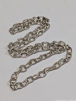 Sterling silver chain necklace laid flat to show full length and links