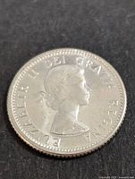 Obverse side of the 1964 Canadian 10 cents coin showing Queen Elizabeth II profile and inscriptions.