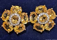 Close up of front side showing the oval citrine stones and central white topaz cluster.